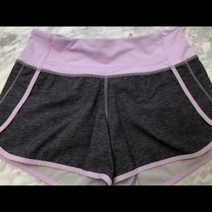 size 4 purple and black lulu lemon shorts